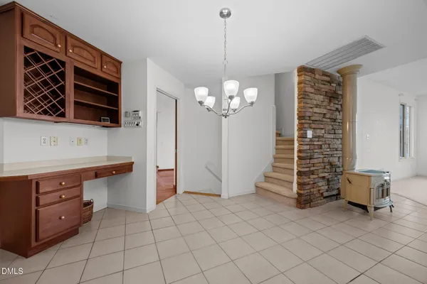 a view of kitchen with granite countertop cabinets
