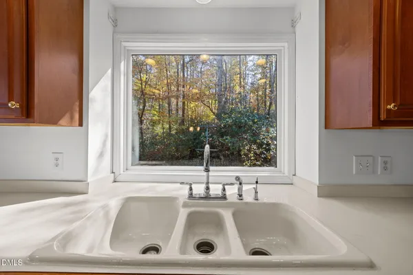a bathroom with a sink and a window