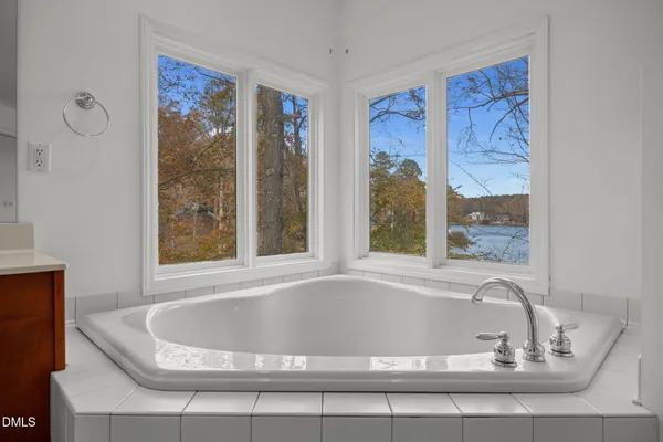 a bath tub sitting next to a window
