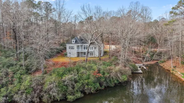 a view of a lake with a yard