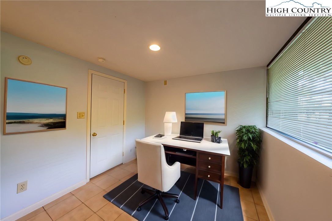 132 Juniper Drive, Unit 132 Boone, NC 28607 - Photo 26 of 36 a workspace with furniture and wooden floor