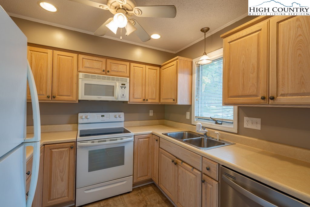 132 Juniper Drive, Unit 132 Boone, NC 28607 - Photo 7 of 36 a kitchen with a sink appliances and cabinets