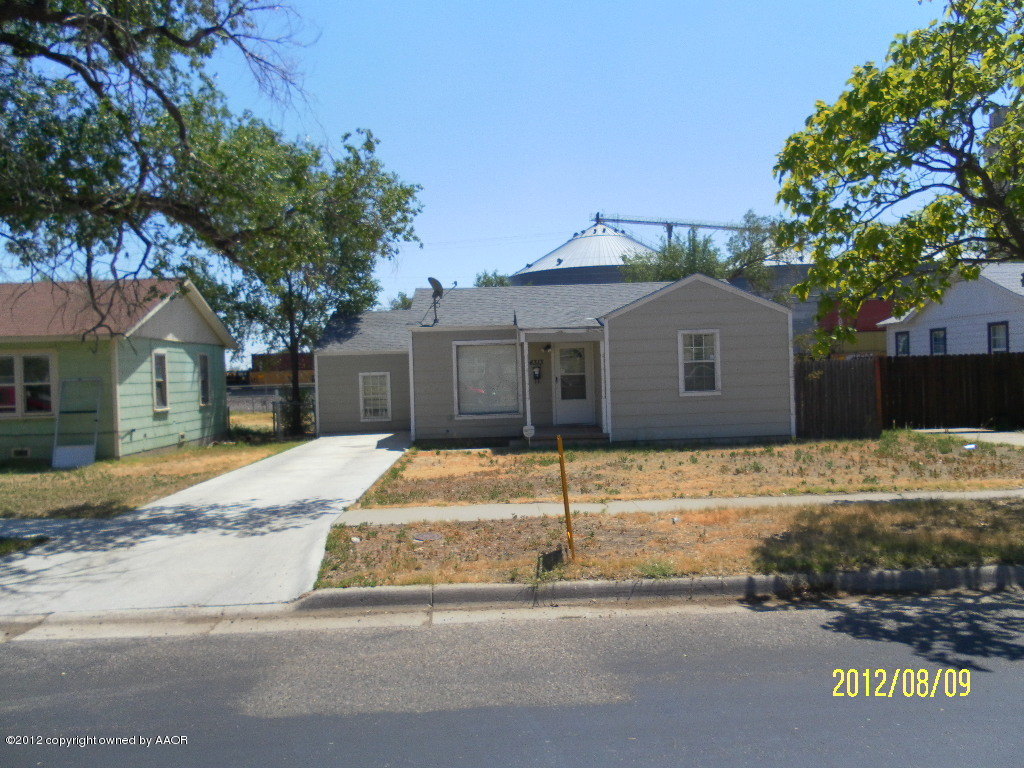 4313 South Polk Street Amarillo, TX 79110 - Photo 1 of 10 a house that has a tree in front of it