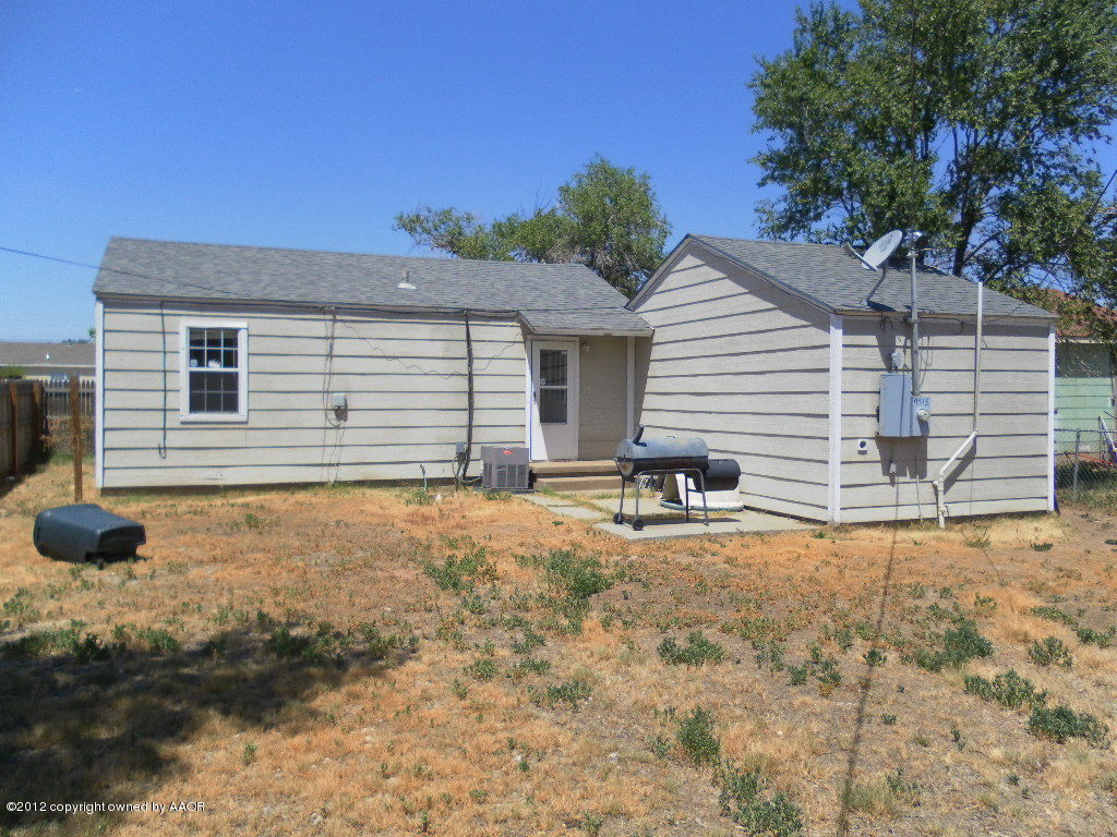 4313 South Polk Street Amarillo, TX 79110 - Photo 10 of 10 a view of a house with backyard and trees