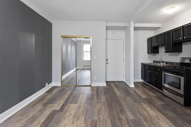 a view of wooden floor and steel cabinets in a room