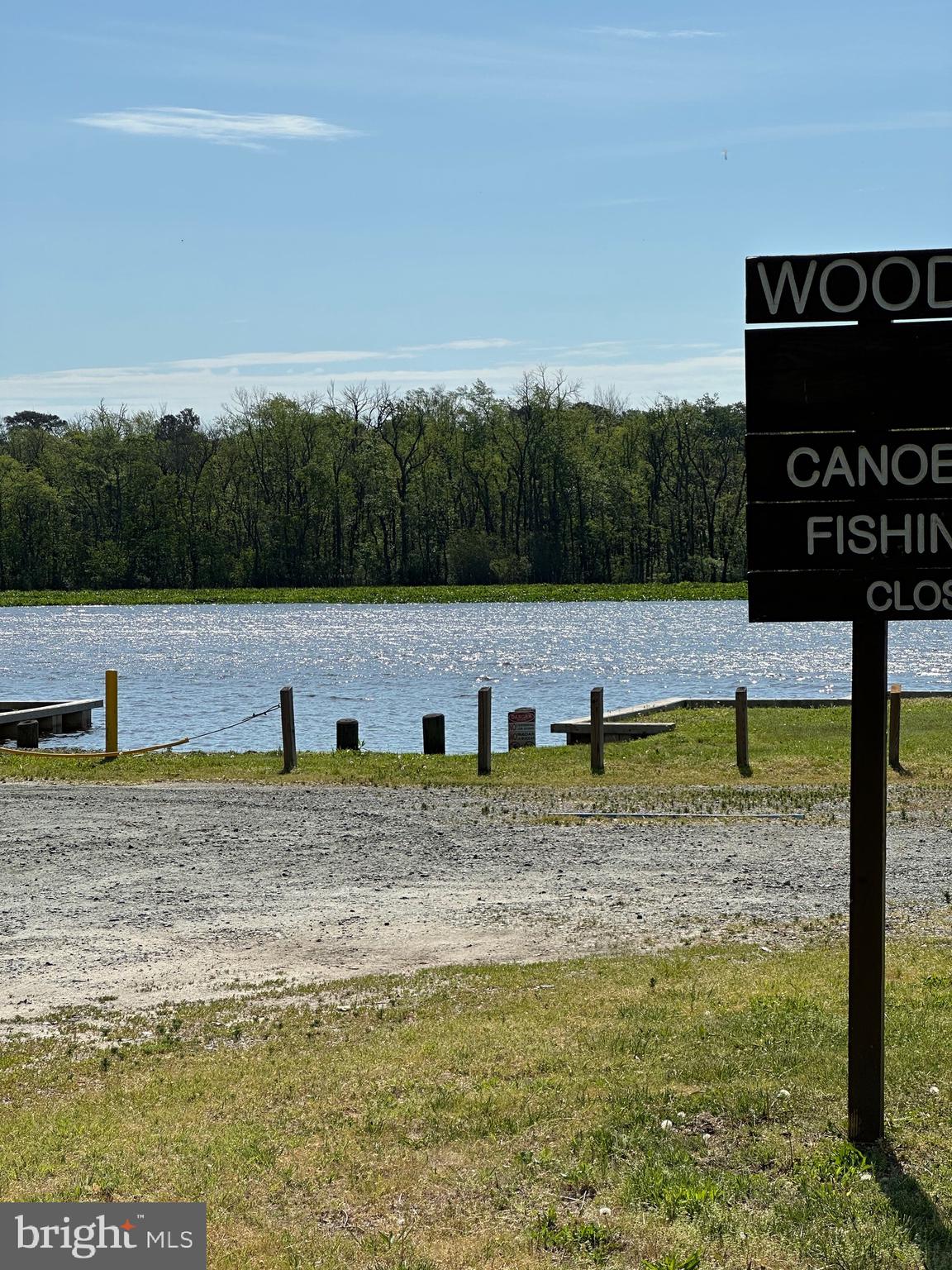 27950 Woodland Road Seaford, DE 19973 - Photo 35 of 43 a view of a swimming pool with a yard