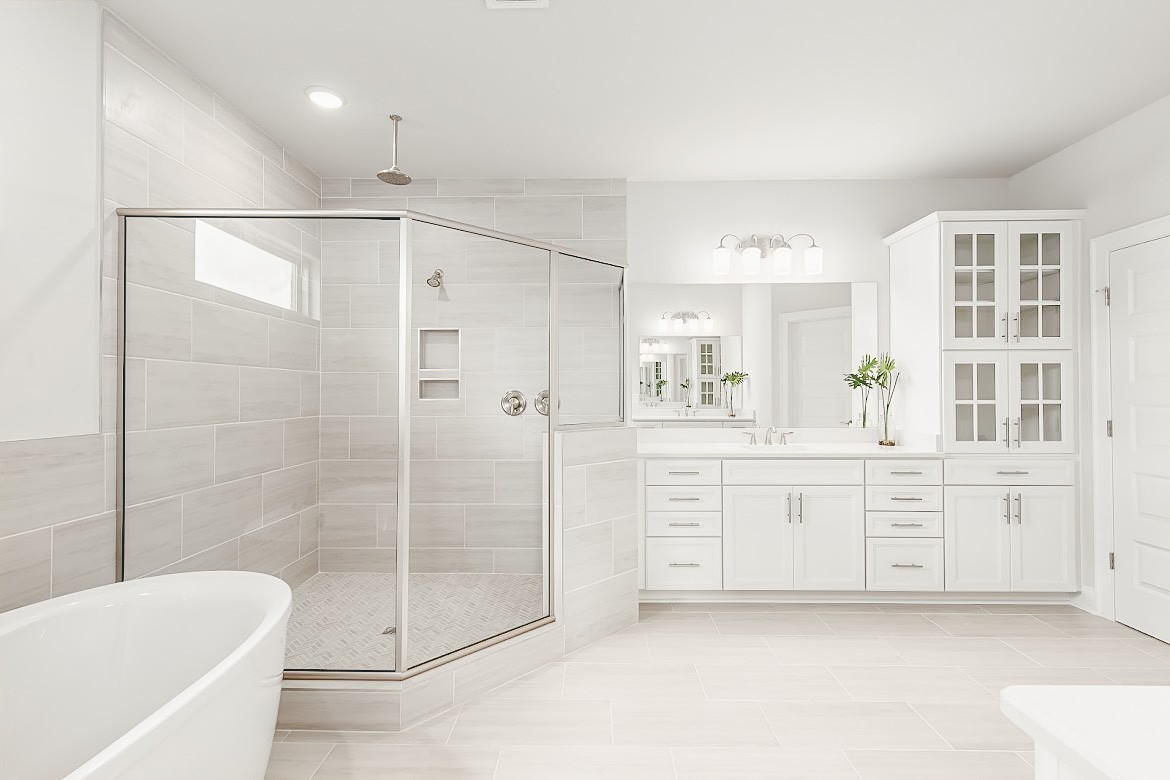 3238 Chase Point Drive Franklin, TN 37067 - Photo 17 of 29 a bathroom with a shower a sink a mirror and a bathtub