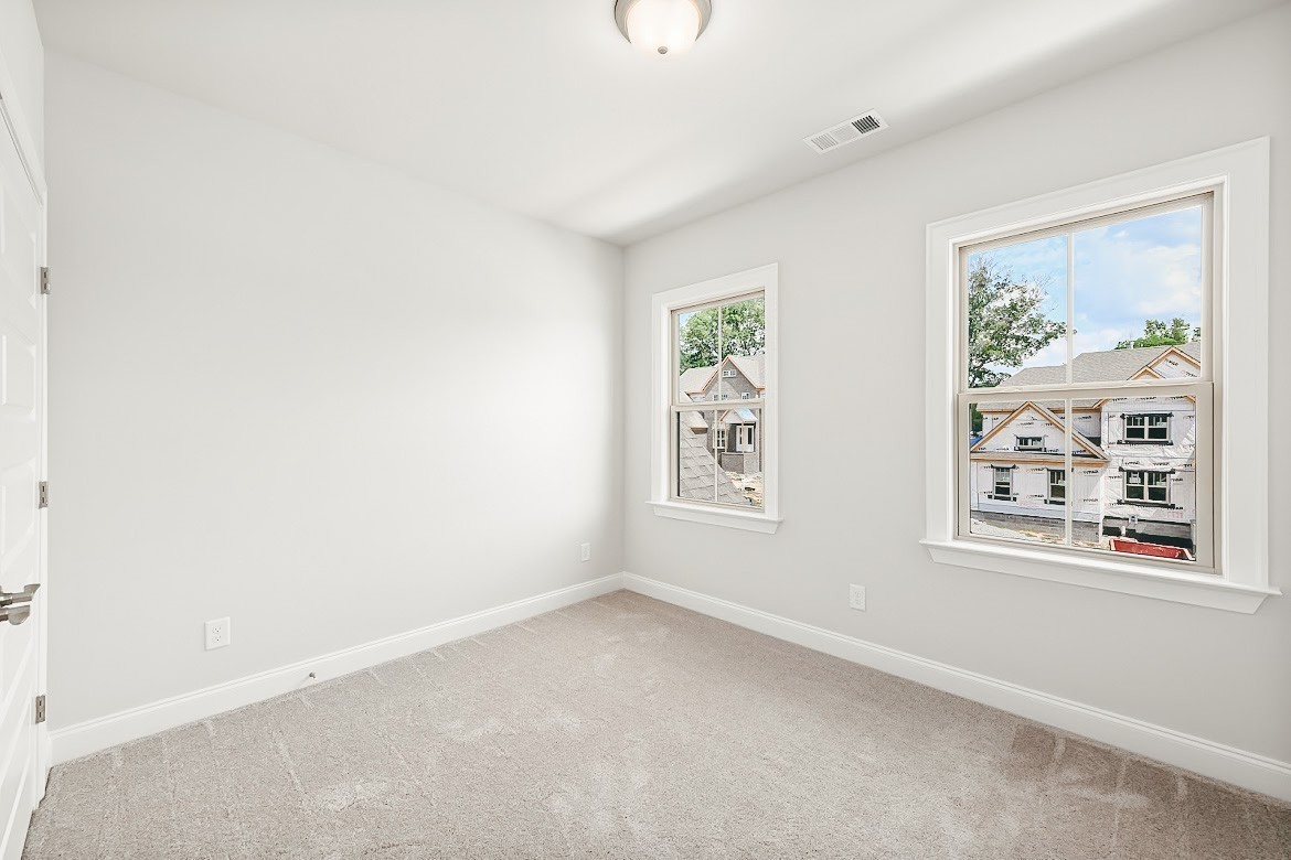 3238 Chase Point Drive Franklin, TN 37067 - Photo 19 of 29 an empty room with windows and refrigerator