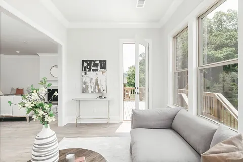 a living room with furniture and a large window