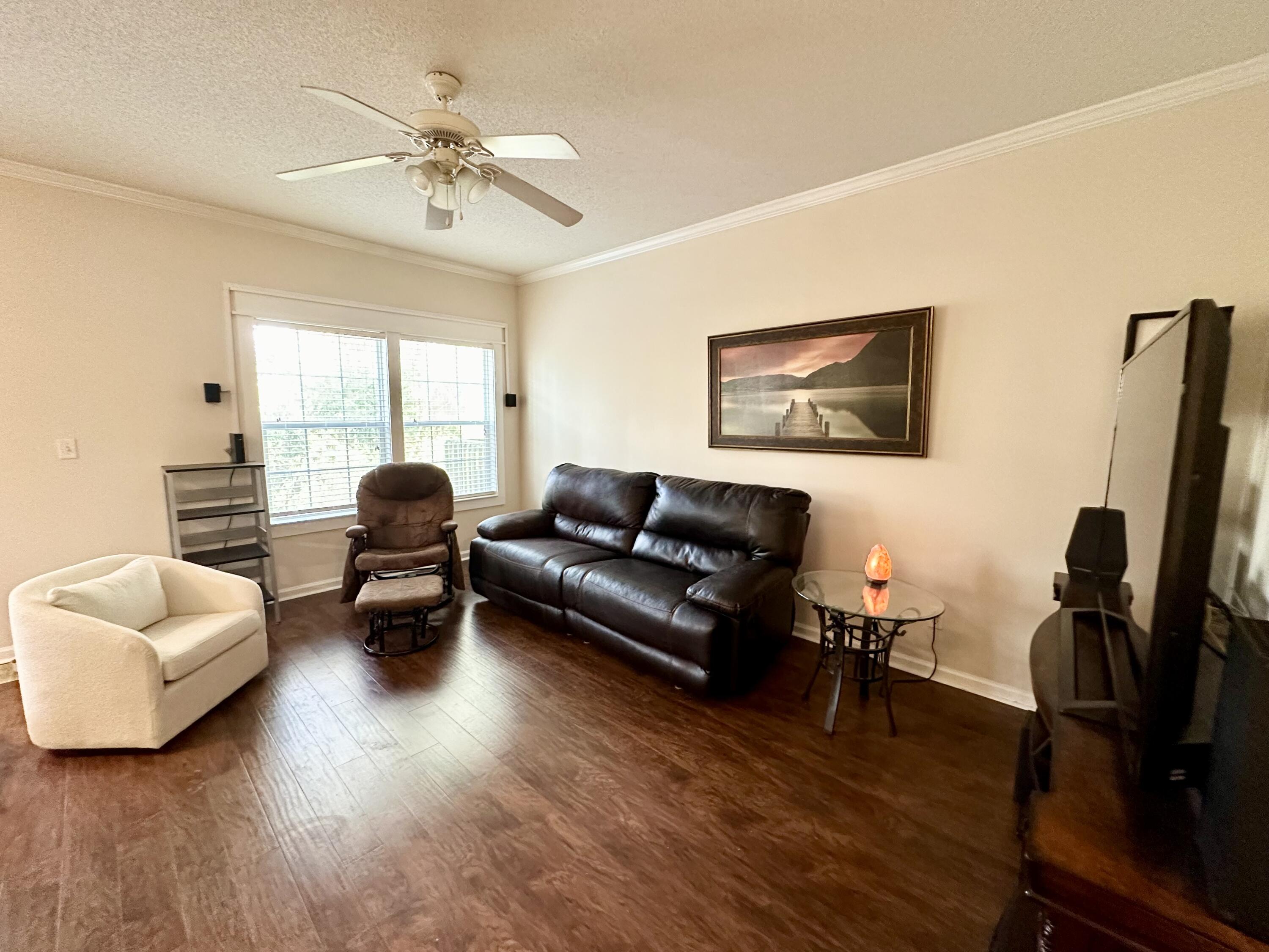 732 East Mack Bayou Drive, Unit 2 Santa Rosa Beach, FL 32459 - Photo 1 of 43 a living room with furniture rug and window