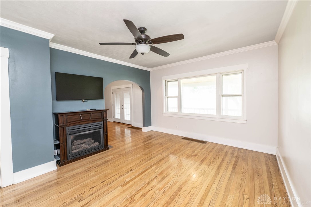 190 Swailes Road Troy, OH 45373 - Photo 16 of 82 This bright living area features rich hardwood floors and a cozy fireplace, perfect for gathering.