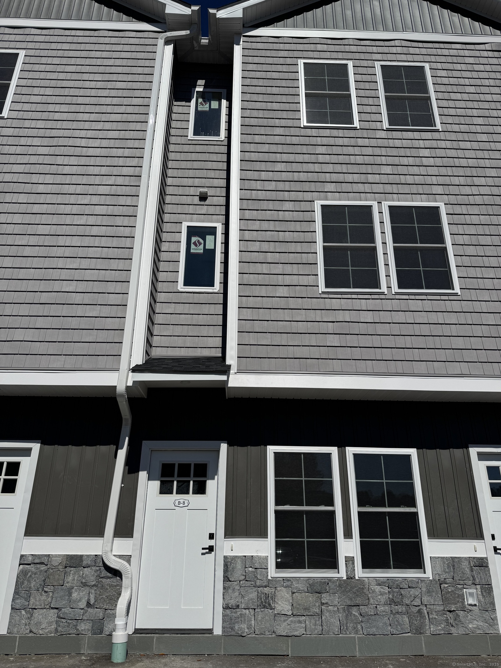 243 Echo Lake Road, Unit B8 Watertown, CT 06795 - Photo 3 of 11 a front view of a house with windows