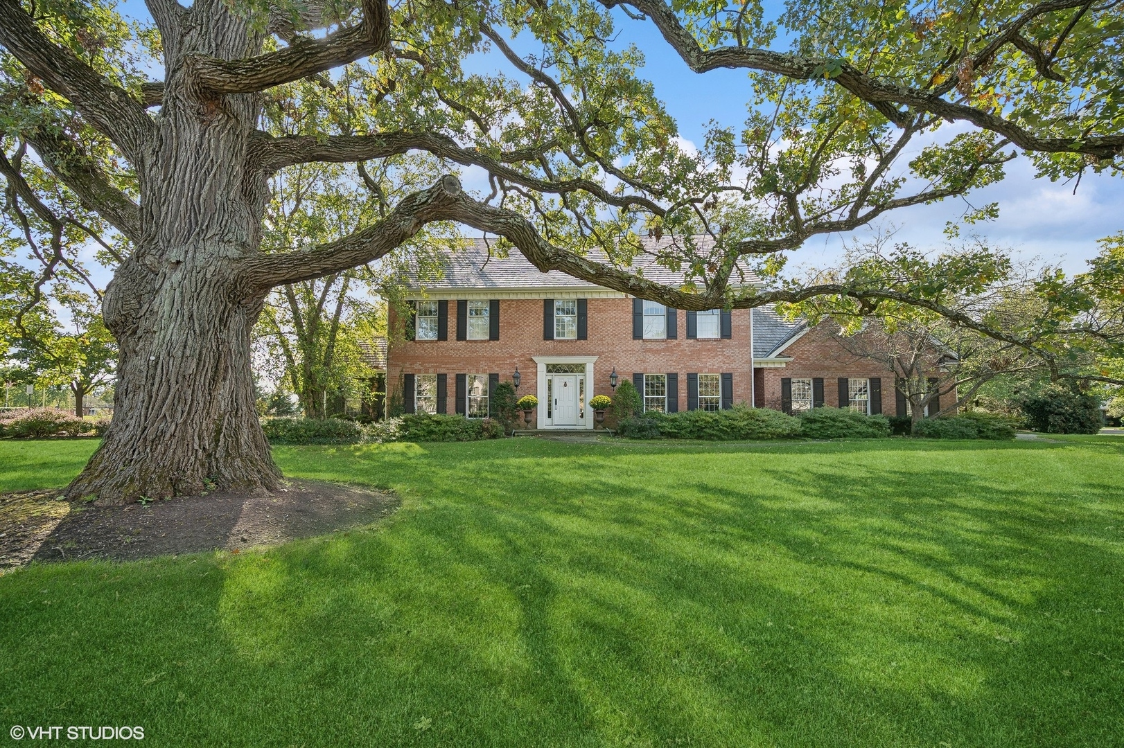 1251 Fiore Drive Lake Forest, IL 60045 - Photo 1 of 31 a view of house in front of a big yard with large trees