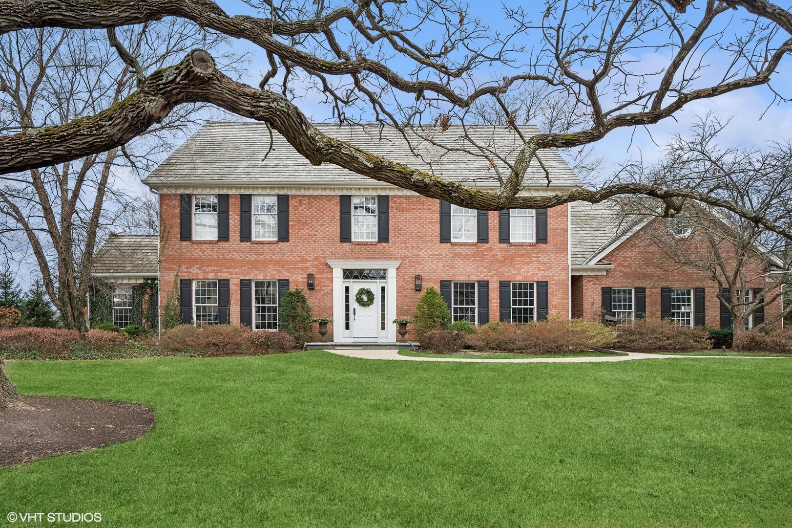 1251 Fiore Drive Lake Forest, IL 60045 - Photo 2 of 31 a front view of a house with a garden
