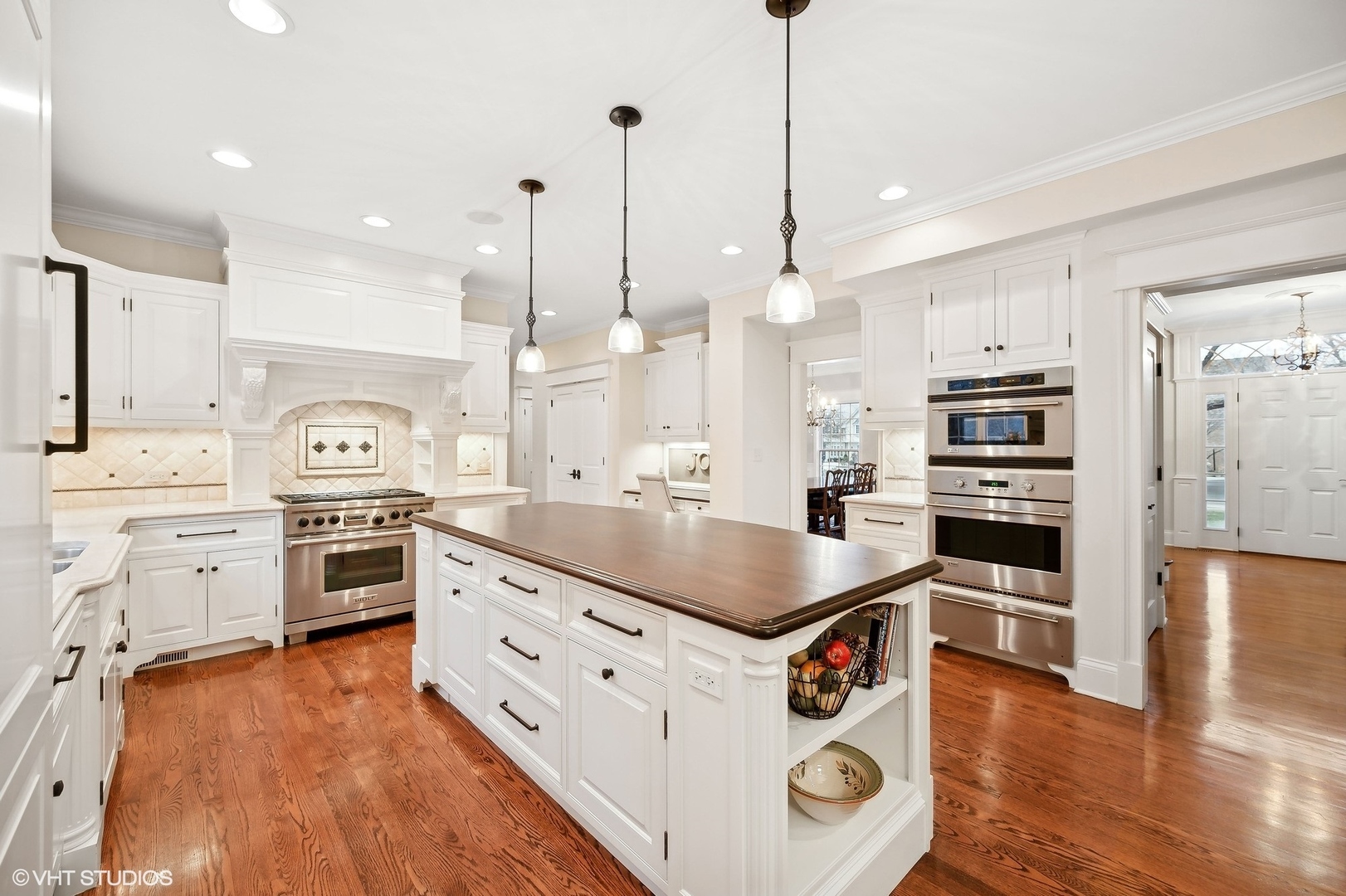 1251 Fiore Drive Lake Forest, IL 60045 - Photo 7 of 31 a kitchen with stainless steel appliances kitchen island granite countertop a stove a sink and a refrigerator