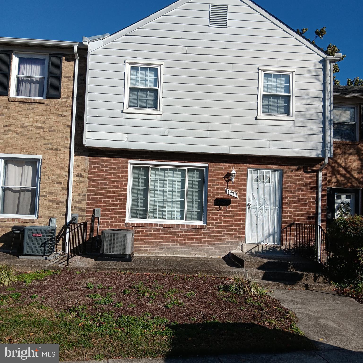 1971 Addison Road South District Heights, MD 20747 - Photo 1 of 30 a front view of a house with a yard
