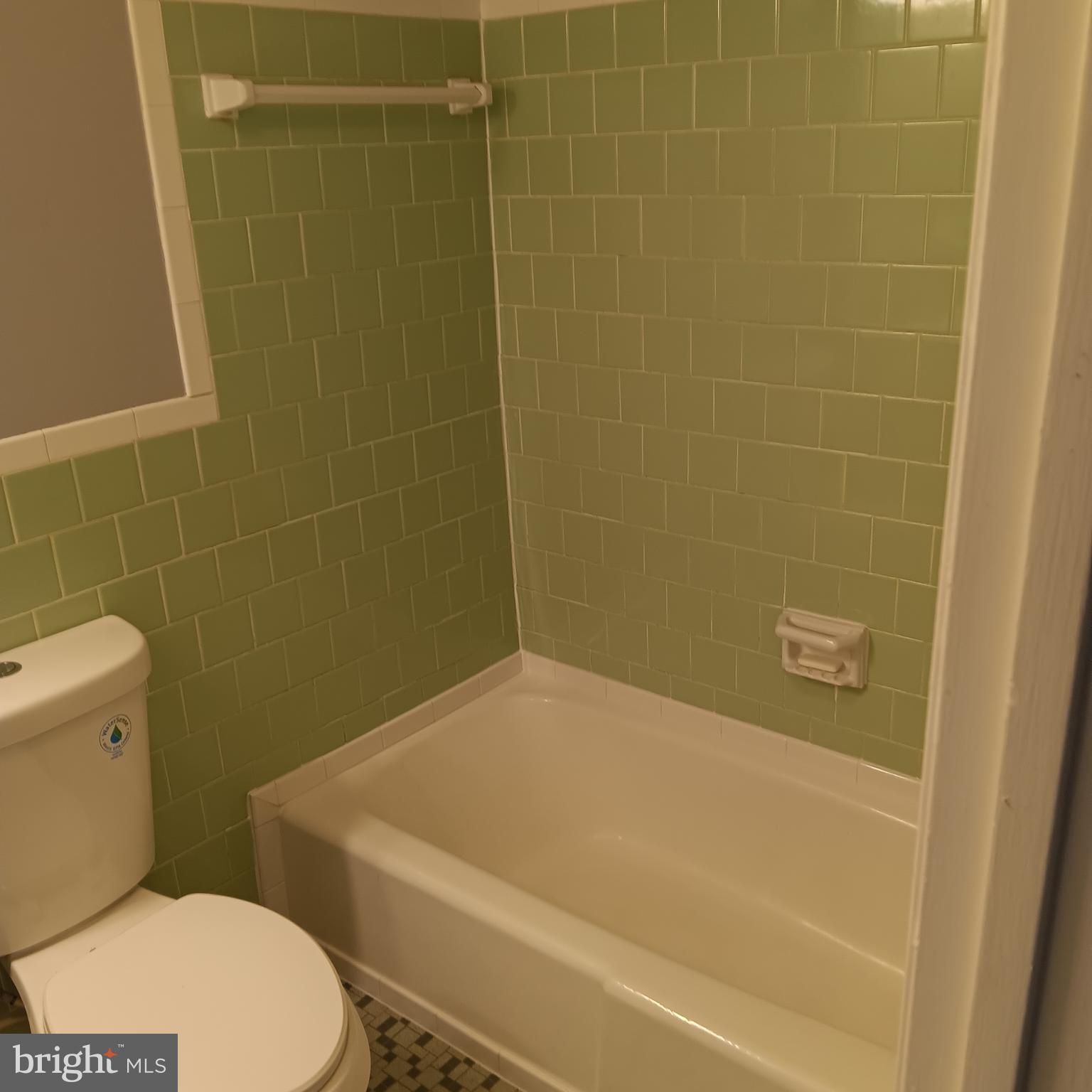 1971 Addison Road South District Heights, MD 20747 - Photo 13 of 30 a white toilet sitting next to a bath tub