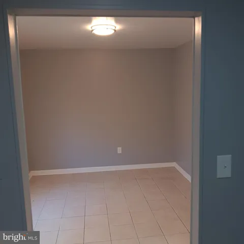 a kitchen with a refrigerator and a stove