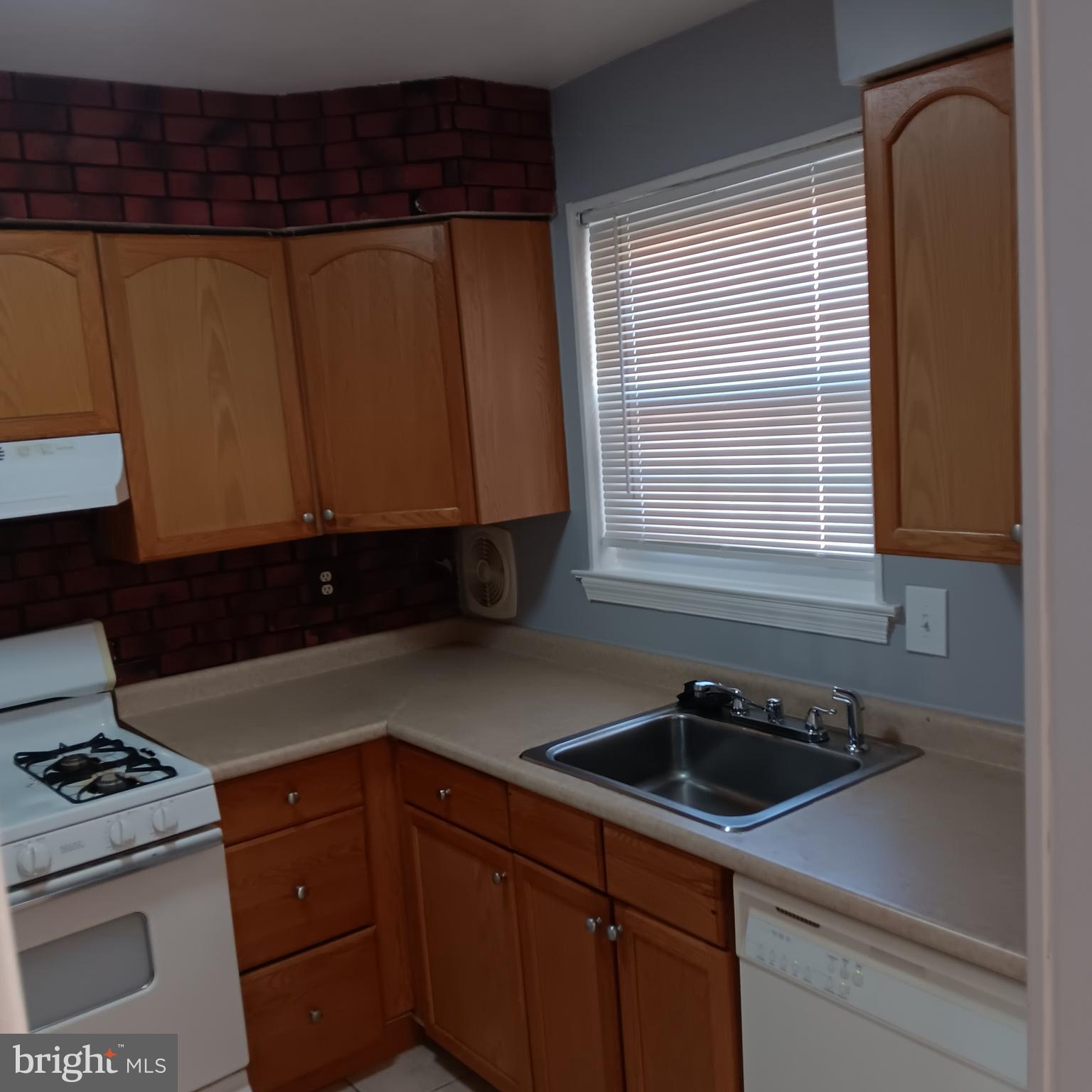 1971 Addison Road South District Heights, MD 20747 - Photo 21 of 30 a kitchen with a sink and cabinets