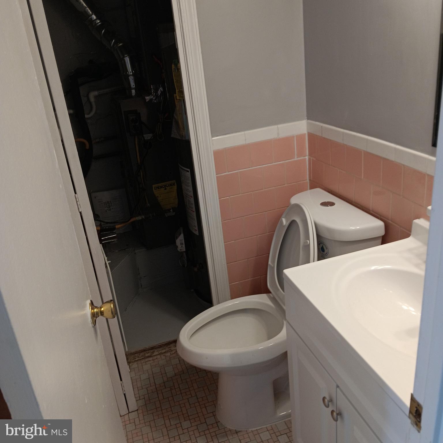 1971 Addison Road South District Heights, MD 20747 - Photo 30 of 30 a bathroom with a toilet and a sink