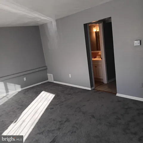 a view of staircase with white walls