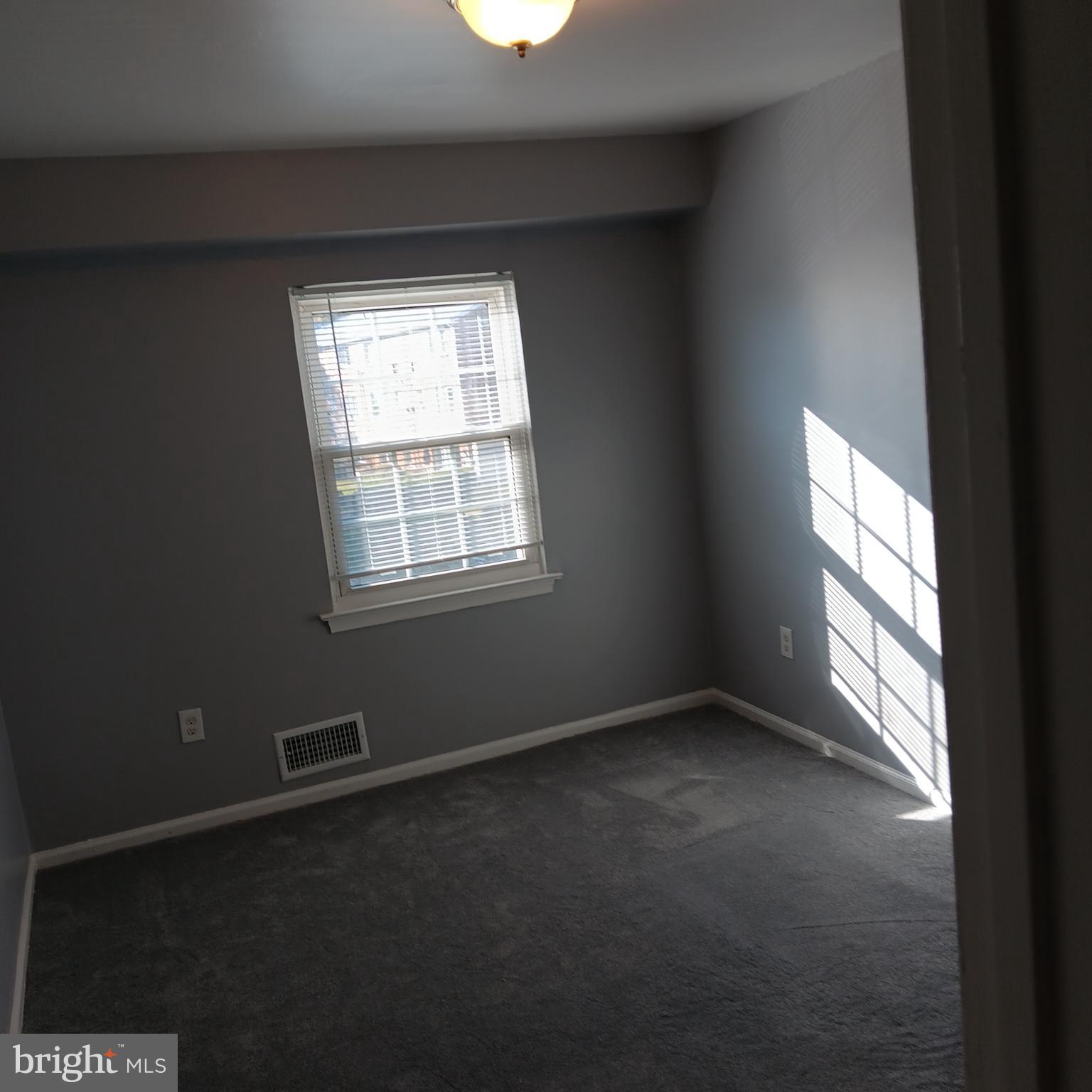 1971 Addison Road South District Heights, MD 20747 - Photo 9 of 30 an empty room with a window