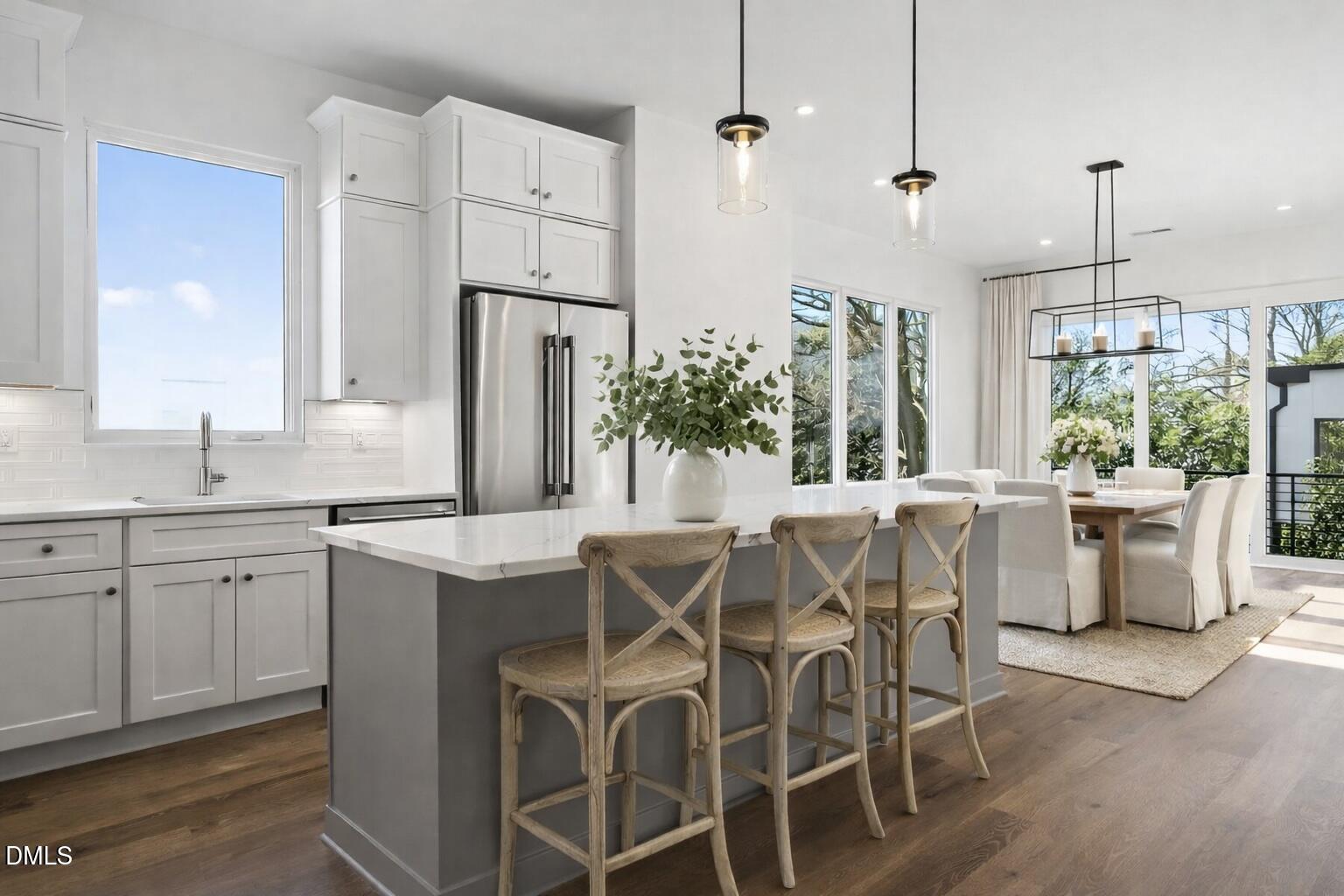 a view of a kitchen with a table and chairs