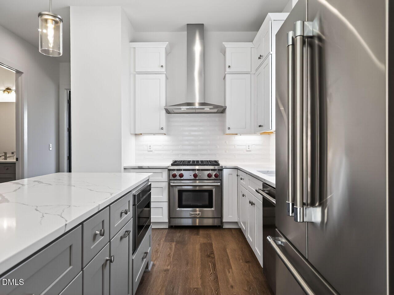 1521 Sunrise Avenue Raleigh, NC 27608 - Photo 19 of 36 a kitchen with stainless steel appliances granite countertop a stove and a refrigerator