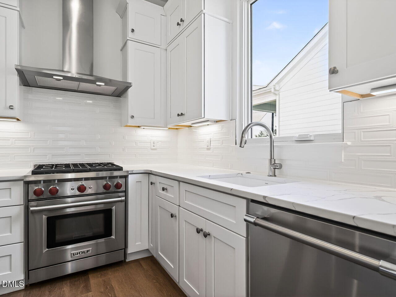 1521 Sunrise Avenue Raleigh, NC 27608 - Photo 20 of 36 a kitchen with a stove and a sink
