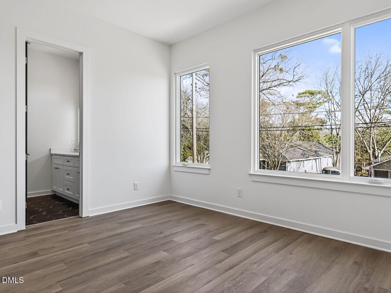 1521 Sunrise Avenue Raleigh, NC 27608 - Photo 23 of 36 an empty room with wooden floor and windows