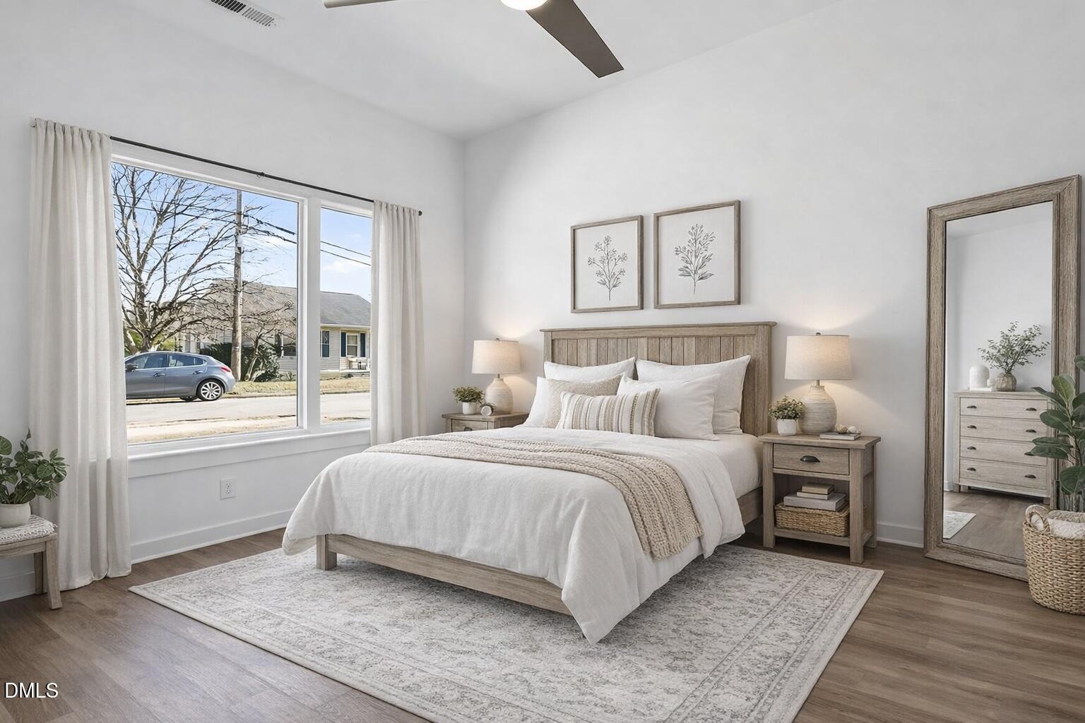 1521 Sunrise Avenue Raleigh, NC 27608 - Photo 8 of 36 a bedroom with a large bed and a window