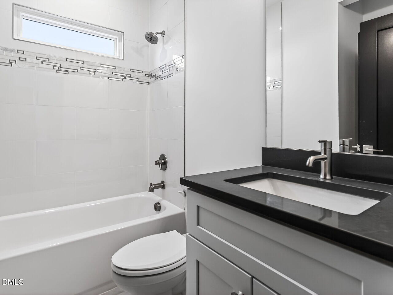 1521 Sunrise Avenue Raleigh, NC 27608 - Photo 10 of 36 a bathroom with a granite countertop sink a toilet and bathtub