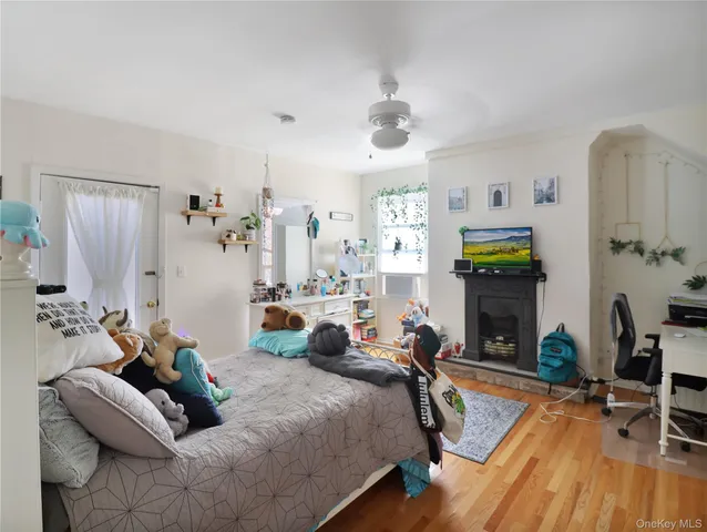 a bedroom with furniture and a fireplace