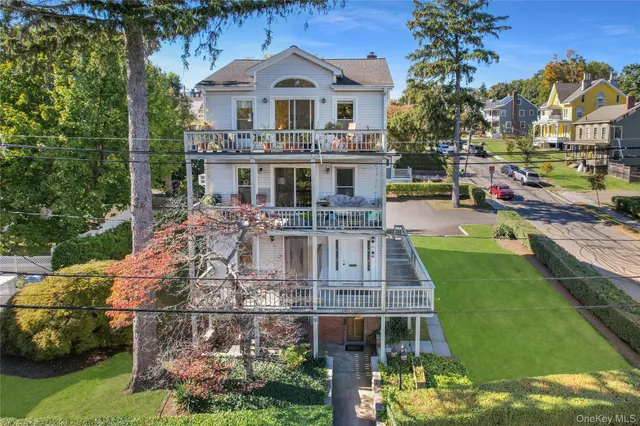 a aerial view of a house with a yard