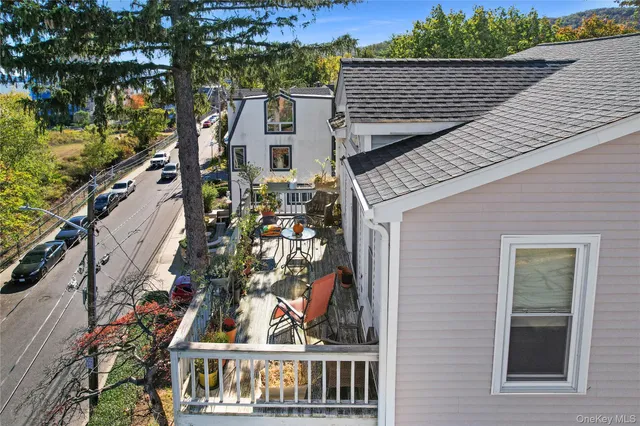 a view of a brick house with a chairs and a table