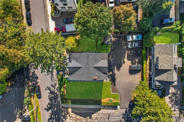 an aerial view of a house with a yard and garden