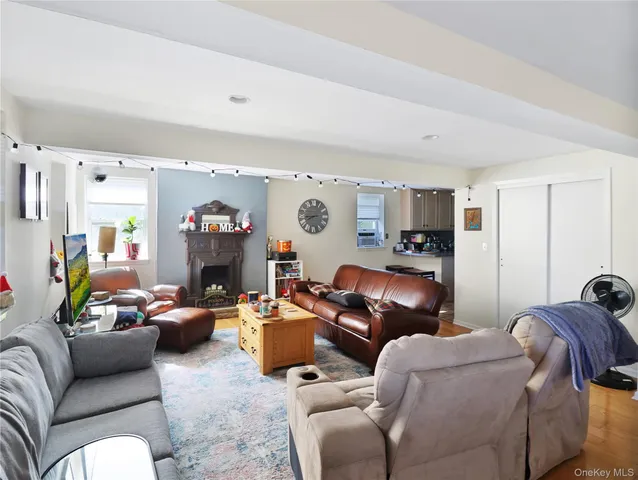 a living room with furniture ceiling fan