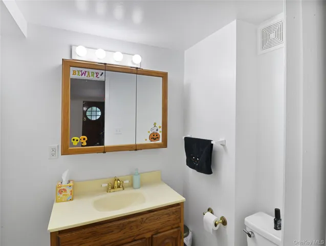 a bathroom with a sink and mirror
