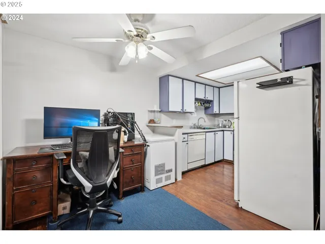 a view of kitchen with cabinets and wooden floor
