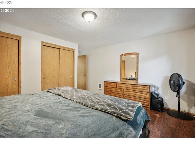 a bedroom with a bed and a table in it