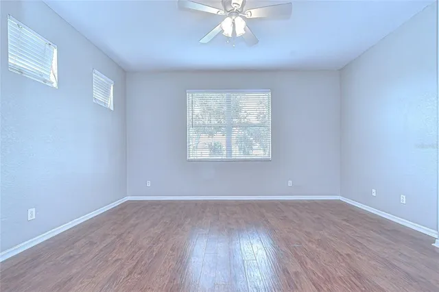 a spacious bathroom with a sink a toilet and shower