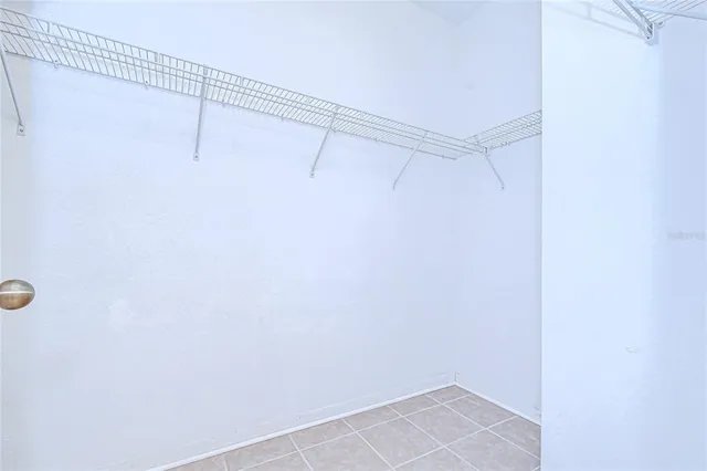 a view of an empty room and wooden floor