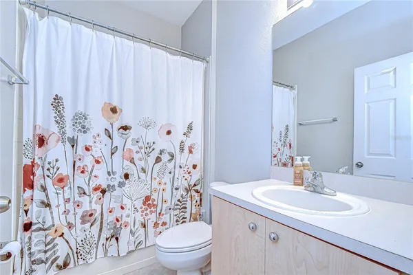 a view of an empty room with a cabinet