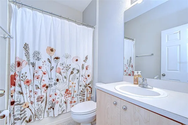 a view of an empty room with a cabinet