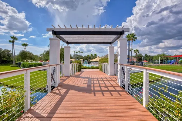 a view of a swimming pool with outdoor seating