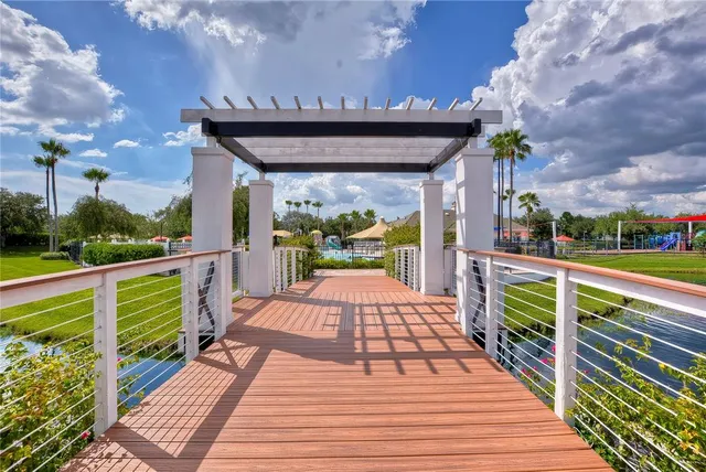a view of a swimming pool with outdoor seating
