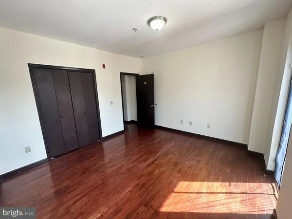 an empty room with wooden floor