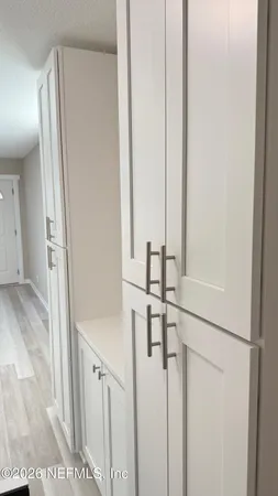 a view of a livingroom from a hallway