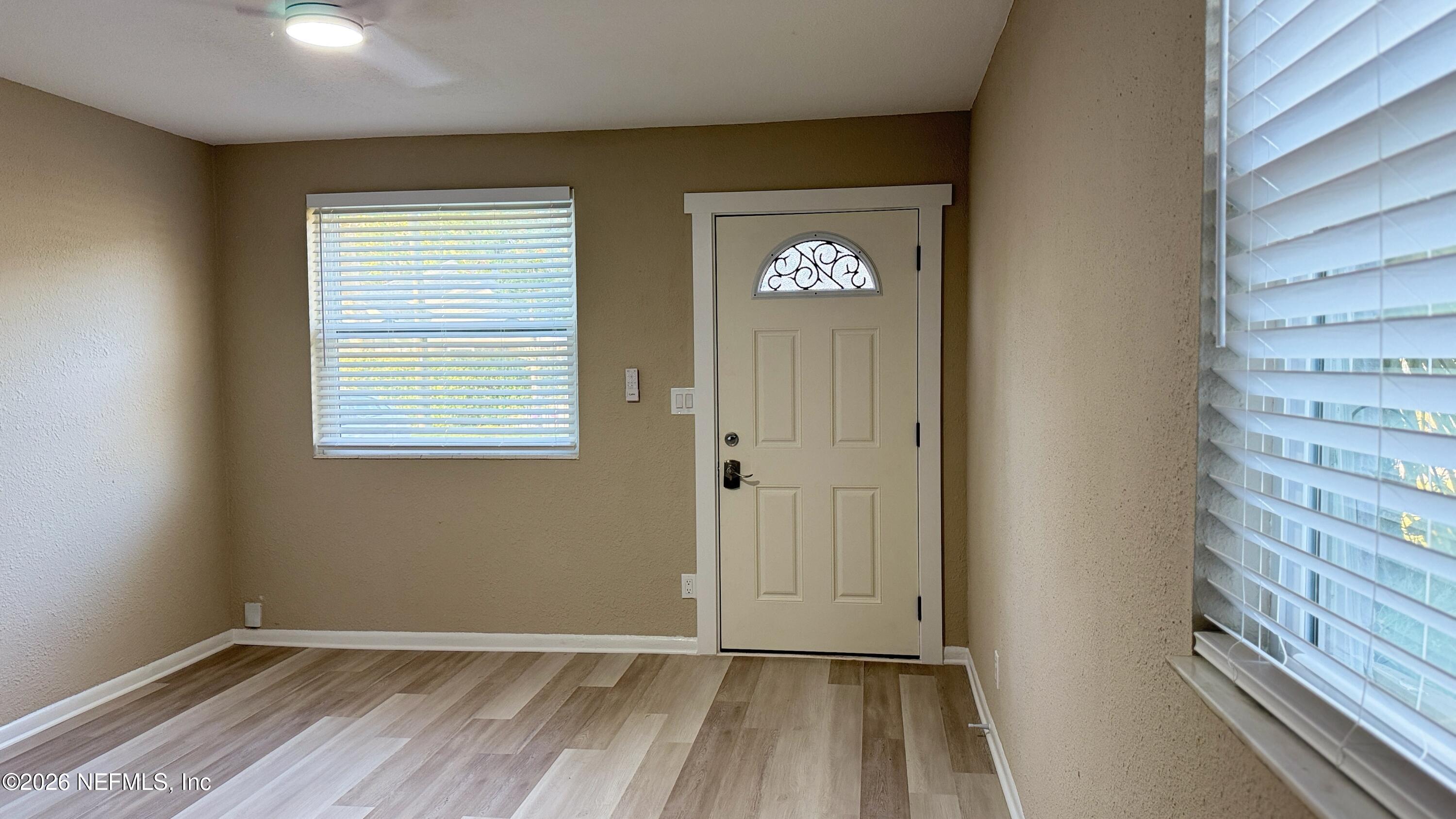 696 Kestner Road Atlantic Beach, FL 32233 - Photo 5 of 18 a view of an empty room with a window