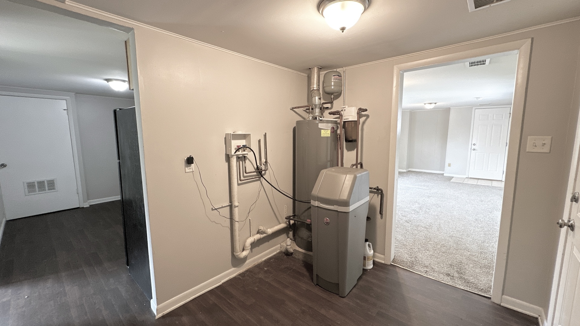 3512 John Street Steger, IL 60475 - Photo 16 of 18 a view of a hallway with wooden floor and workspace